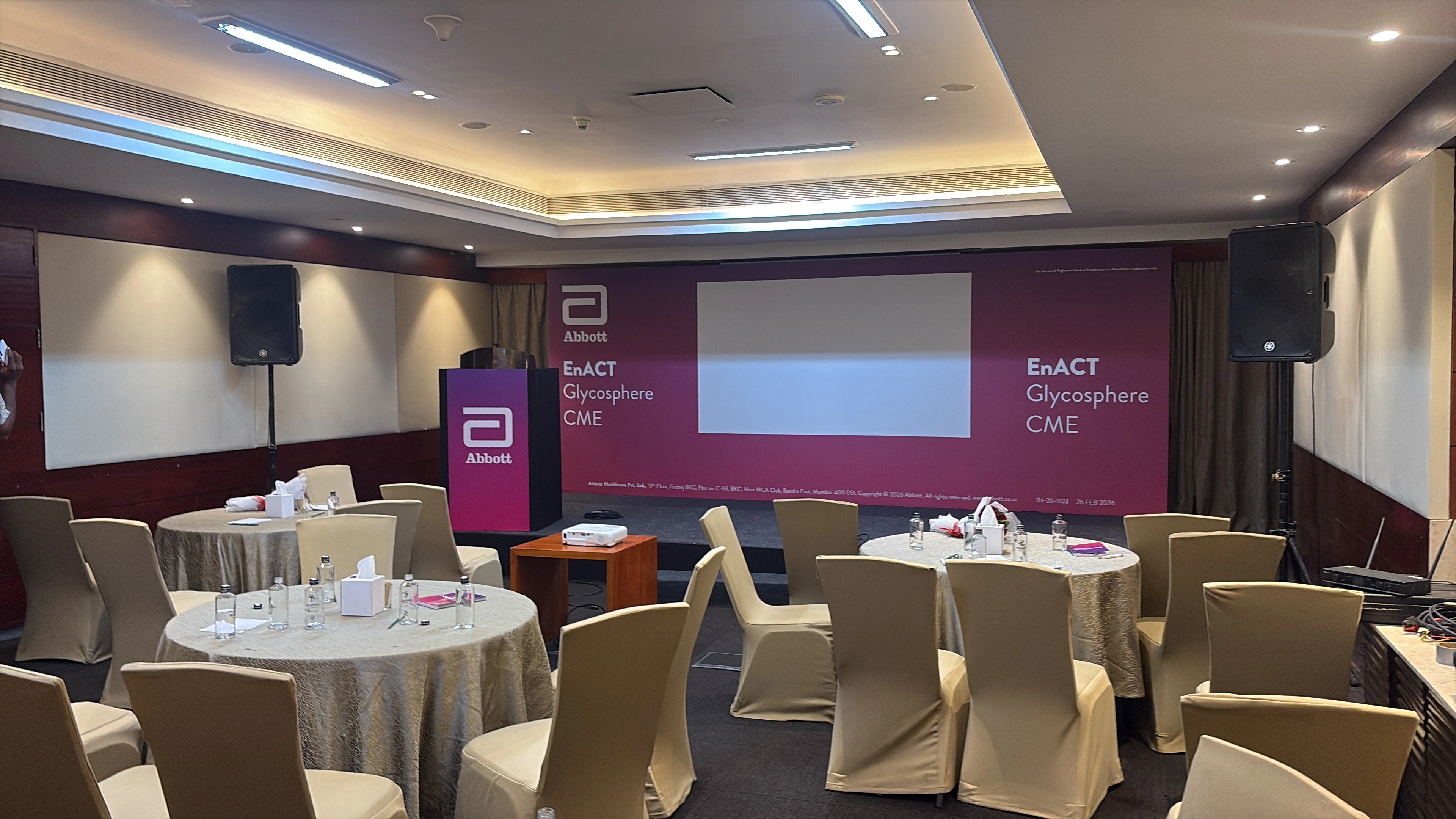 Institutional event stage with formal branding